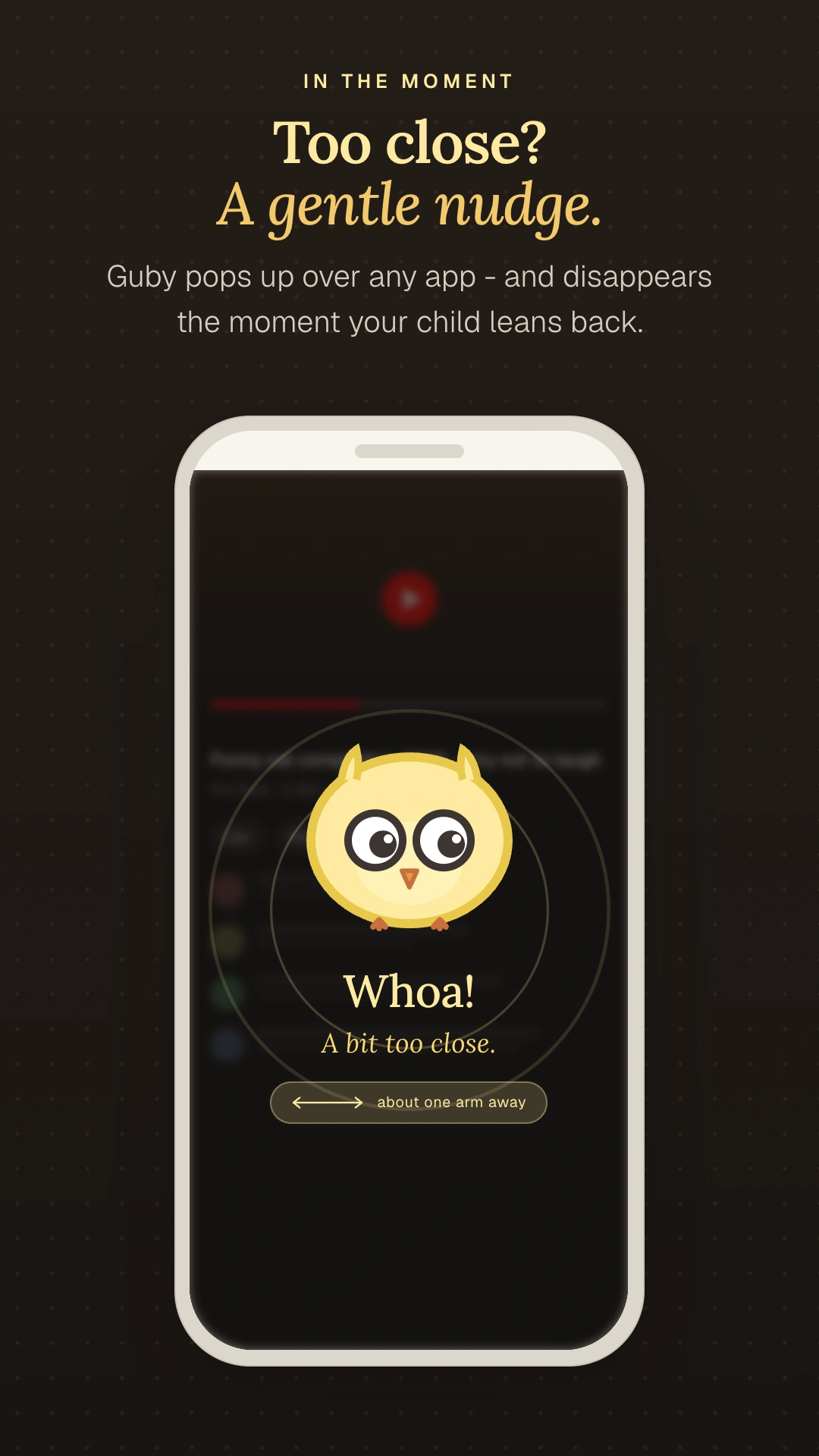 Guby gentle nudge overlay appearing on the child's screen when held too close